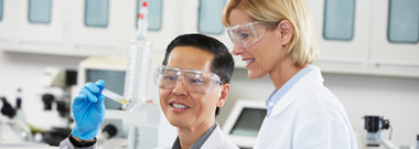 Male and female scientists working in laboratory