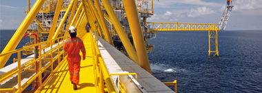 Operator walking at oil rig