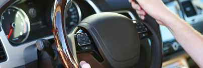Holding a steering wheel