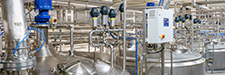 Large, round mixing tanks in pharmaceutical factory