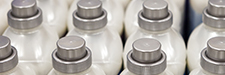 White plastic bottles with grey screw caps